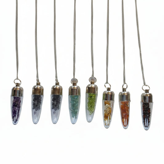 Set of six crystal pendant necklaces on a white background